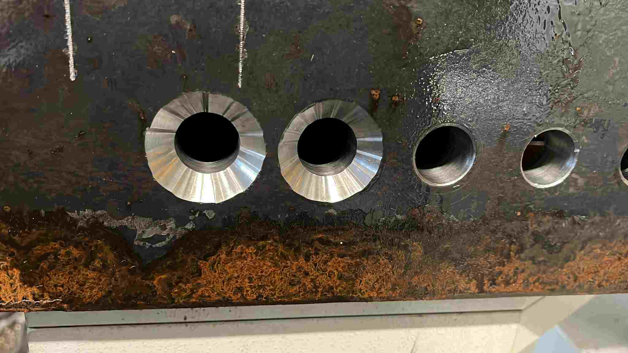 A CNC machined countersink hole with poor finish