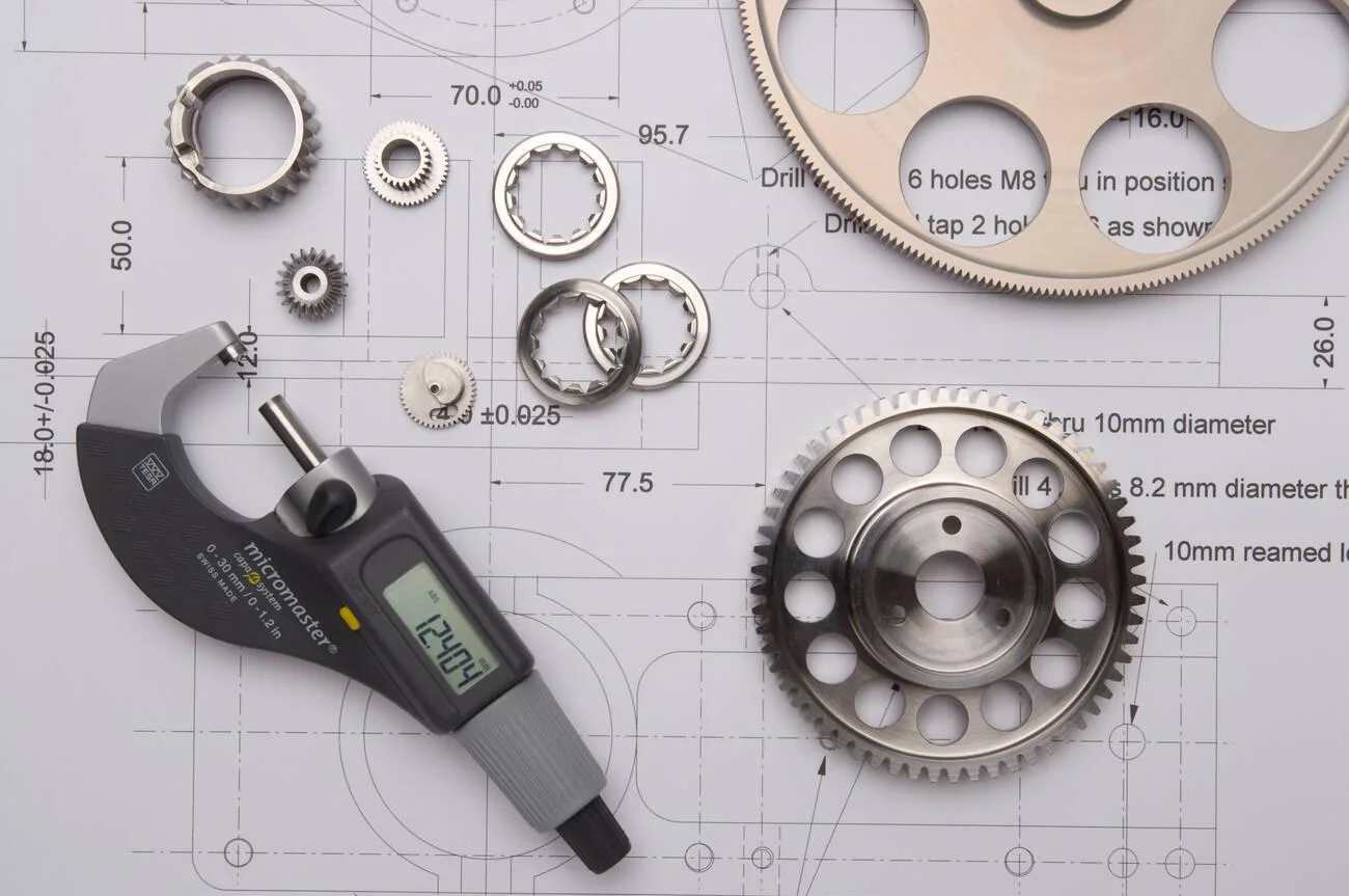 Precision cut cogs and gears overlay technical drawing